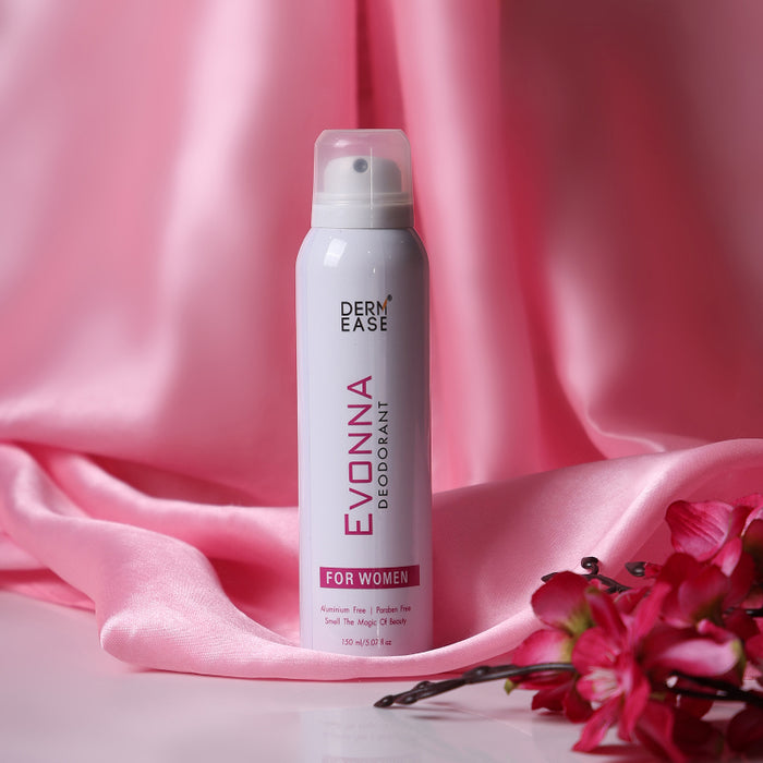 Evonna Deodorant spray bottle for women on a pink fabric background with flowers.