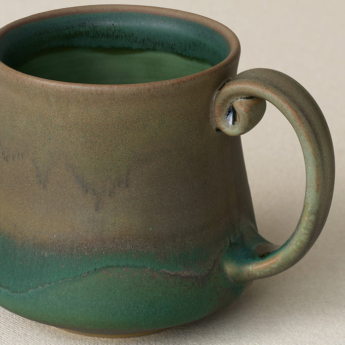 Close-up details of hand-thrown mug by Rookwood