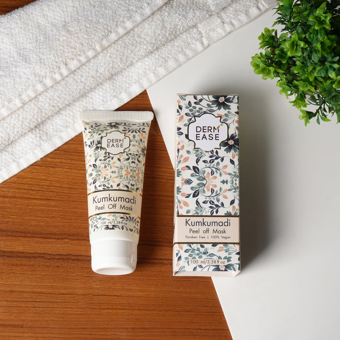 Kumkumadi peel off mask with packaging on a wooden surface
