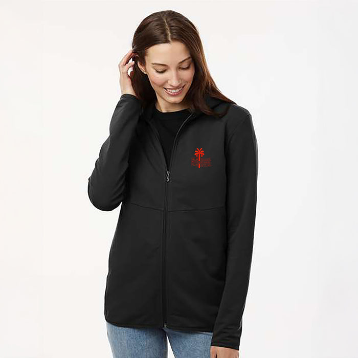 Woman wearing a black jacket with a red logo on a white background
