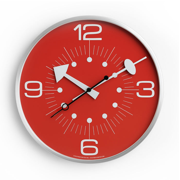 Red wall clock with white numbers and silver frame on a white background