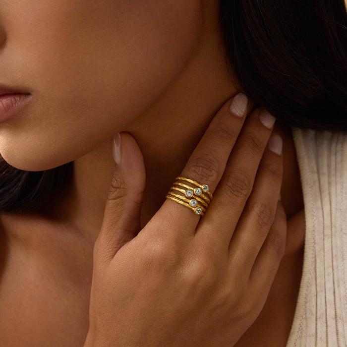 Model wearing the Abundant Prosperity Blue Topaz Ring, showcasing its elegant design and shine. This meaningful ring serves as a beautiful piece of spiritual jewelry, perfect for yoga, meditation, and invoking prosperity and protection through its symbolic blue topaz gems.