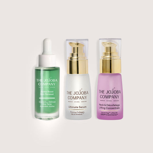 Three skincare products from The Jojoba Company on a light gray background