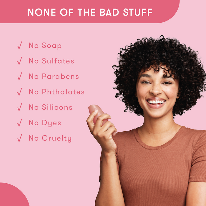 Model holding HiBAR conditioner bar in her hand with a list of bad things that are not in HiBAR. No soap. No sulfates. No parabens. No phthalates. No silicons. No dyes. No cruelty.