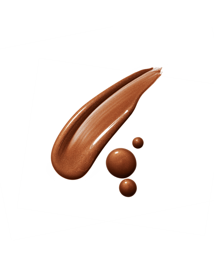 Eaze Drop’Lit All-Over Glow Enhancer smear shown in shade Bronze Jasper.
