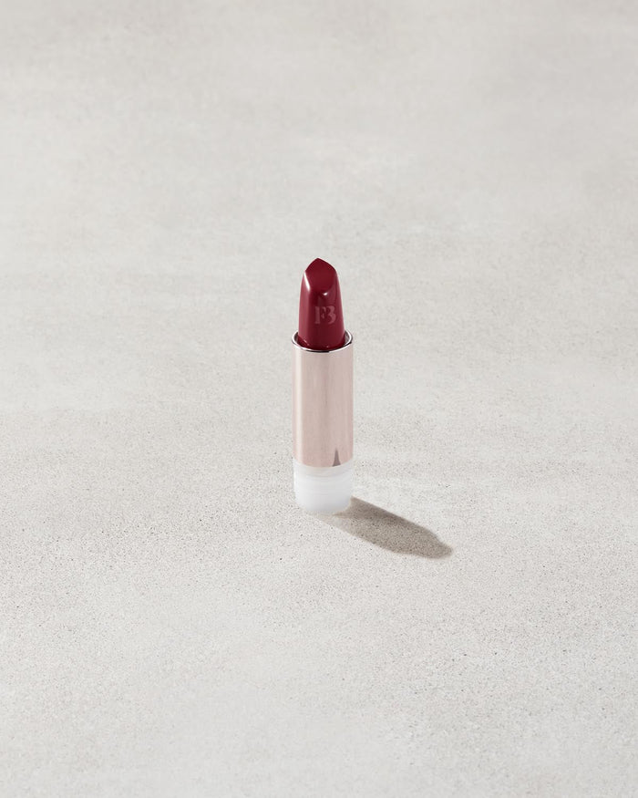 An open Fenty Icon refillable matte lipstick in the high-pigment shade, Board Memb'r.