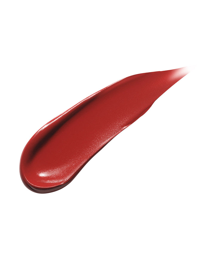 Smear showing the texture of high-pigment Fenty Icon matte lipstick in the maple red shade, Grill Mast'r.