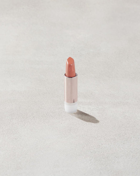 An open Fenty Icon refillable matte lipstick in the high-pigment shade, Pose Queen.