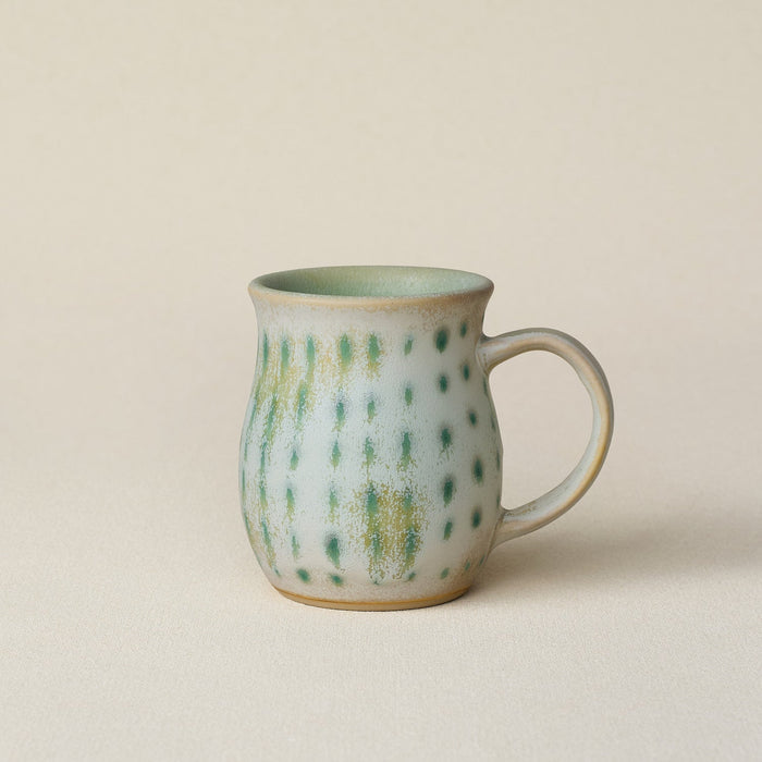 Hand-thrown ceramic mug by Rookwood Pottery