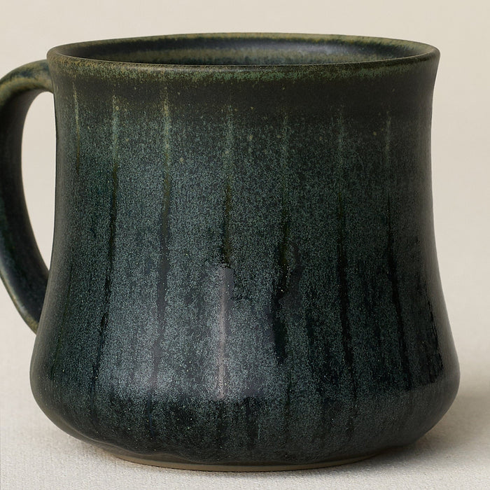 Close-up details of hand-thrown mug by Rookwood