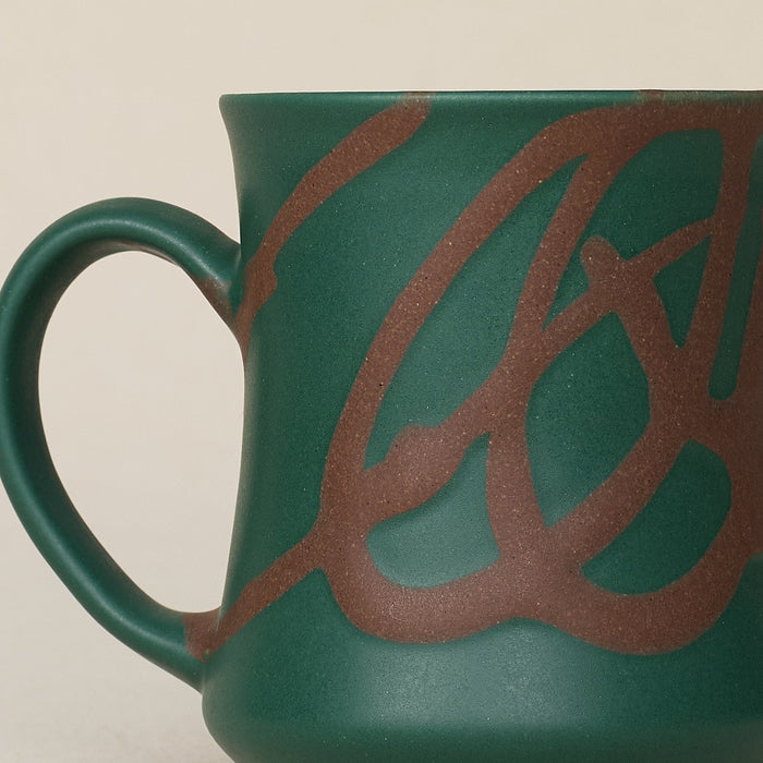 Close-up details of hand-thrown mug by Rookwood