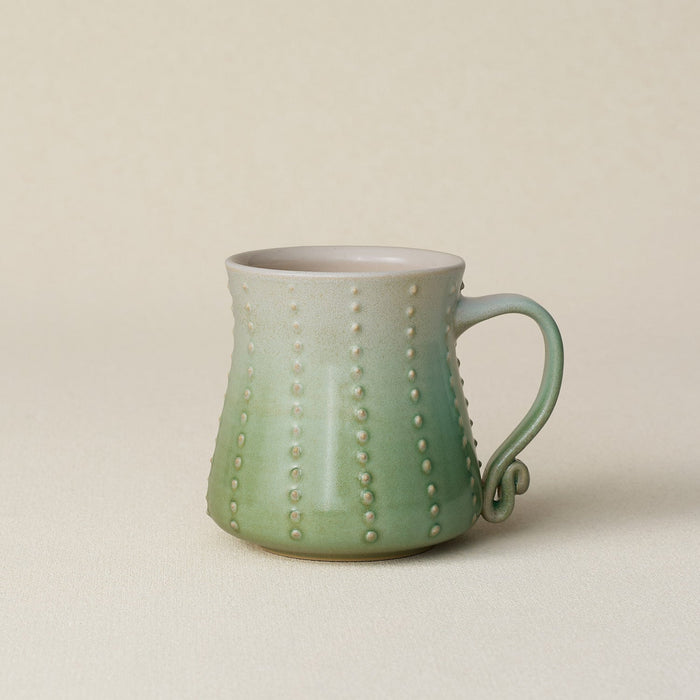 Hand-thrown ceramic mug by Rookwood Pottery