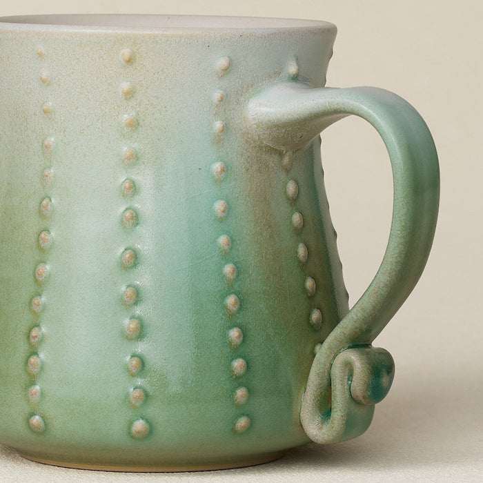Close-up details of hand-thrown mug by Rookwood