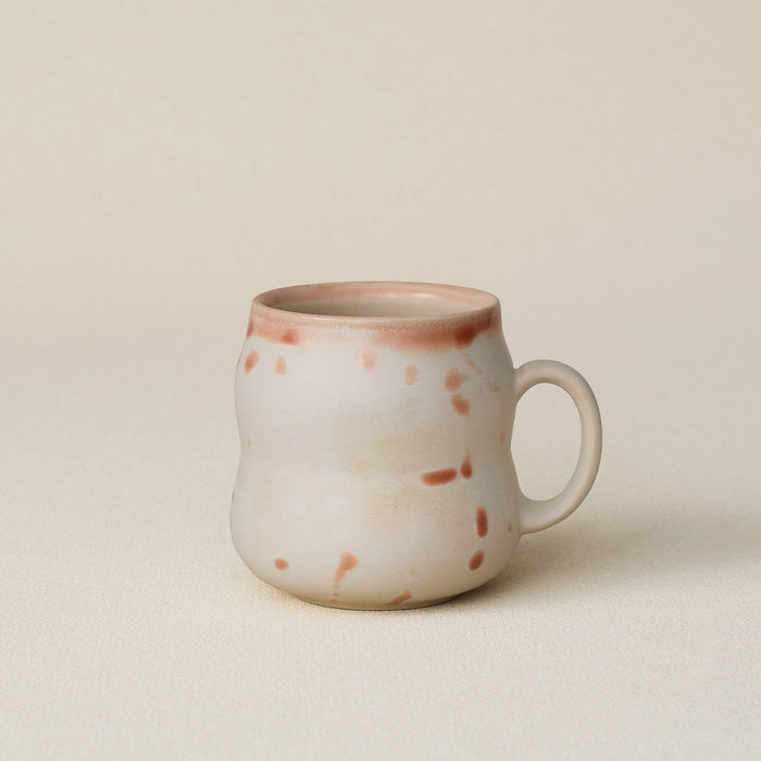 Hand-thrown ceramic mug by Rookwood Pottery