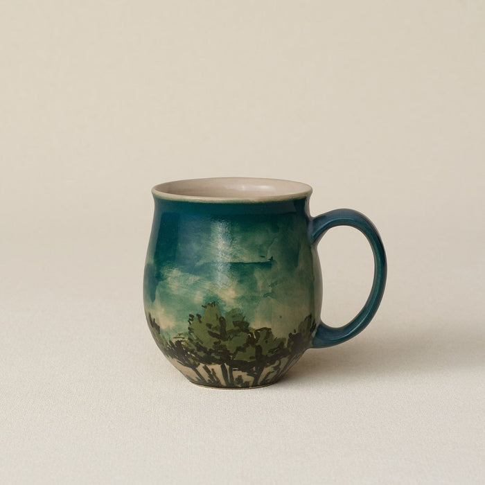 Hand-thrown ceramic mug by Rookwood Pottery
