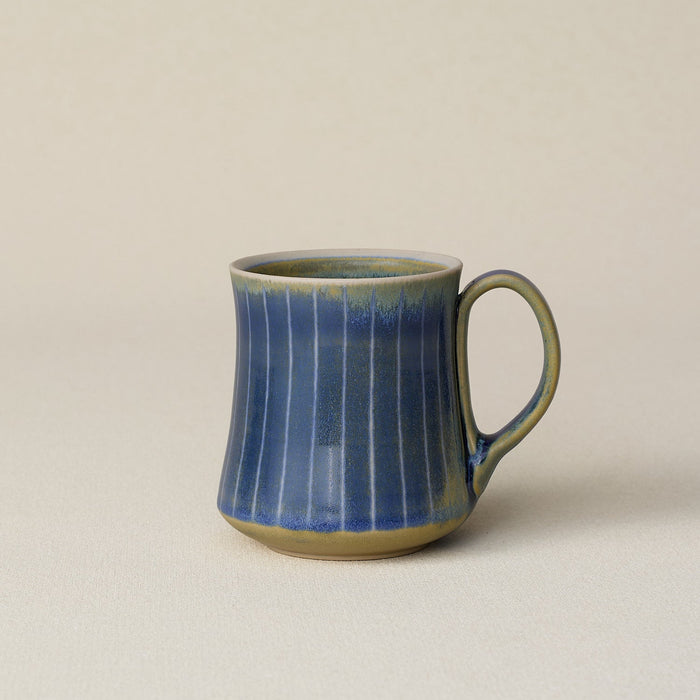 Hand-thrown ceramic mug by Rookwood Pottery
