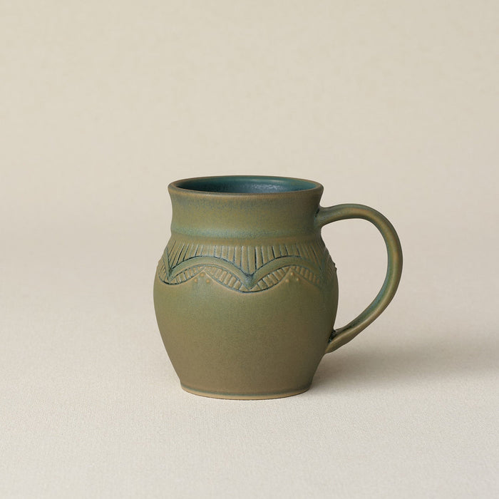 Hand-thrown ceramic mug by Rookwood Pottery