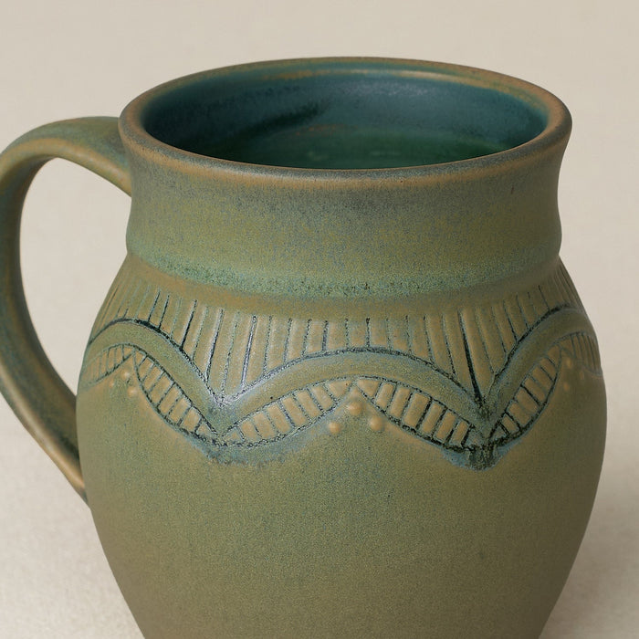 Close-up details of hand-thrown mug by Rookwood
