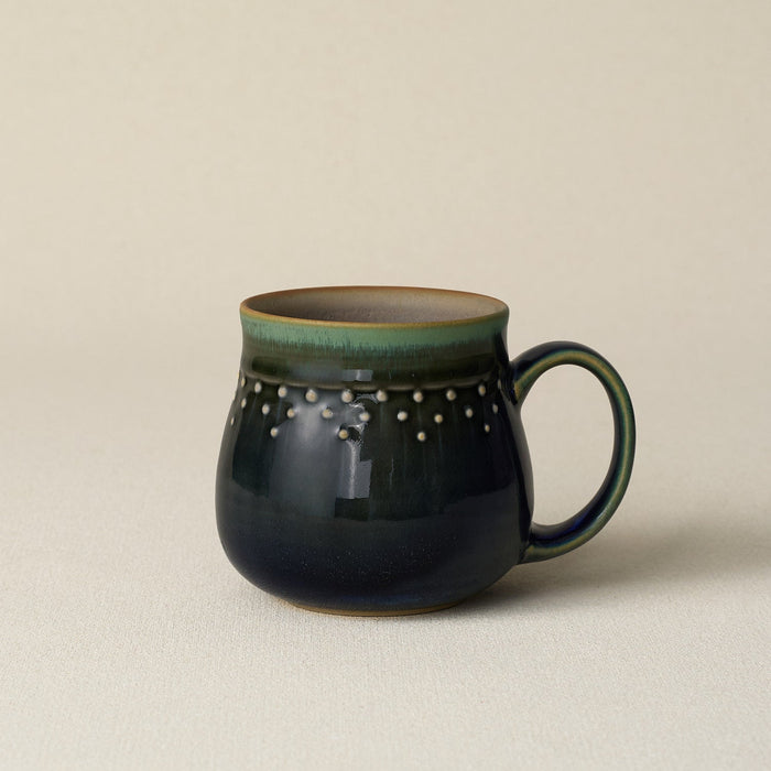 Hand-thrown ceramic mug by Rookwood Pottery