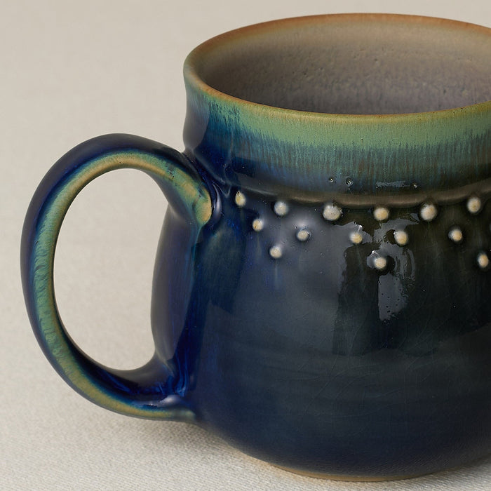 Close-up details of hand-thrown mug by Rookwood