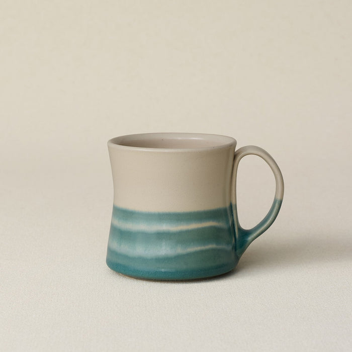 Hand-thrown ceramic mug by Rookwood Pottery