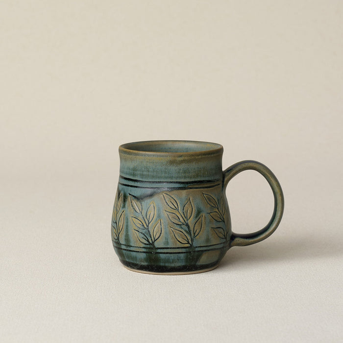 Hand-thrown ceramic mug by Rookwood Pottery
