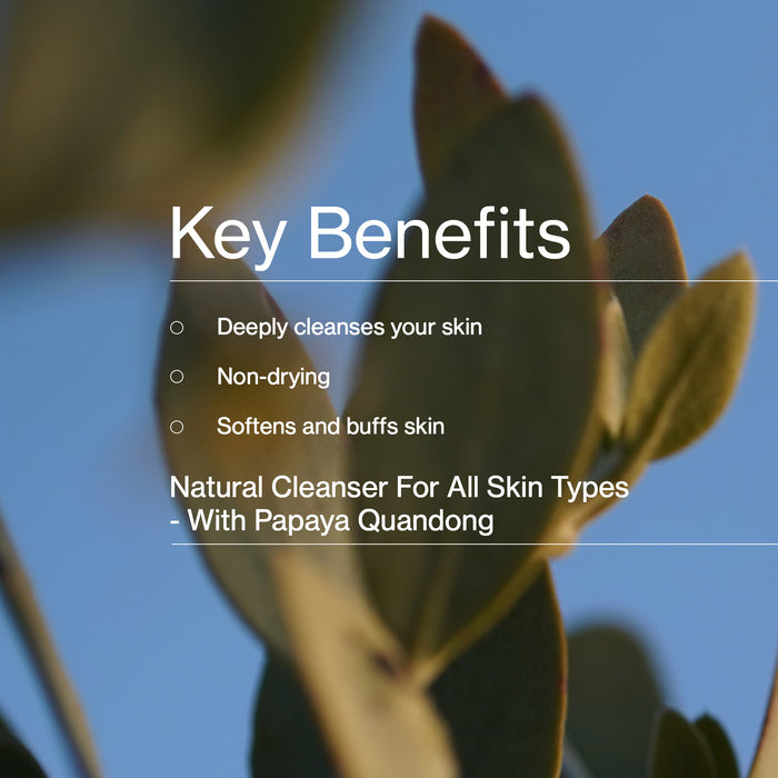 Text listing key benefits of a natural cleanser with a blurred plant background