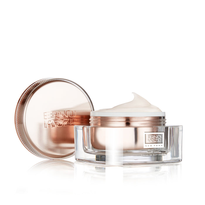 Phelityl® night cream jar with rose-gold lid, open container showing white cream